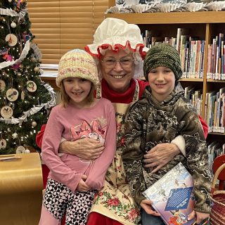 Mrs. Claus with Two Children
